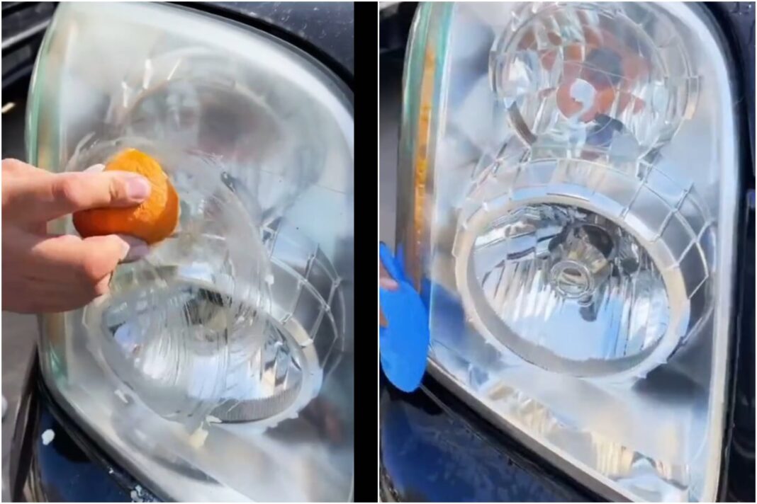 Persona frotando media naranja con bicarbonato sobre un faro de auto opaco para limpiarlo.